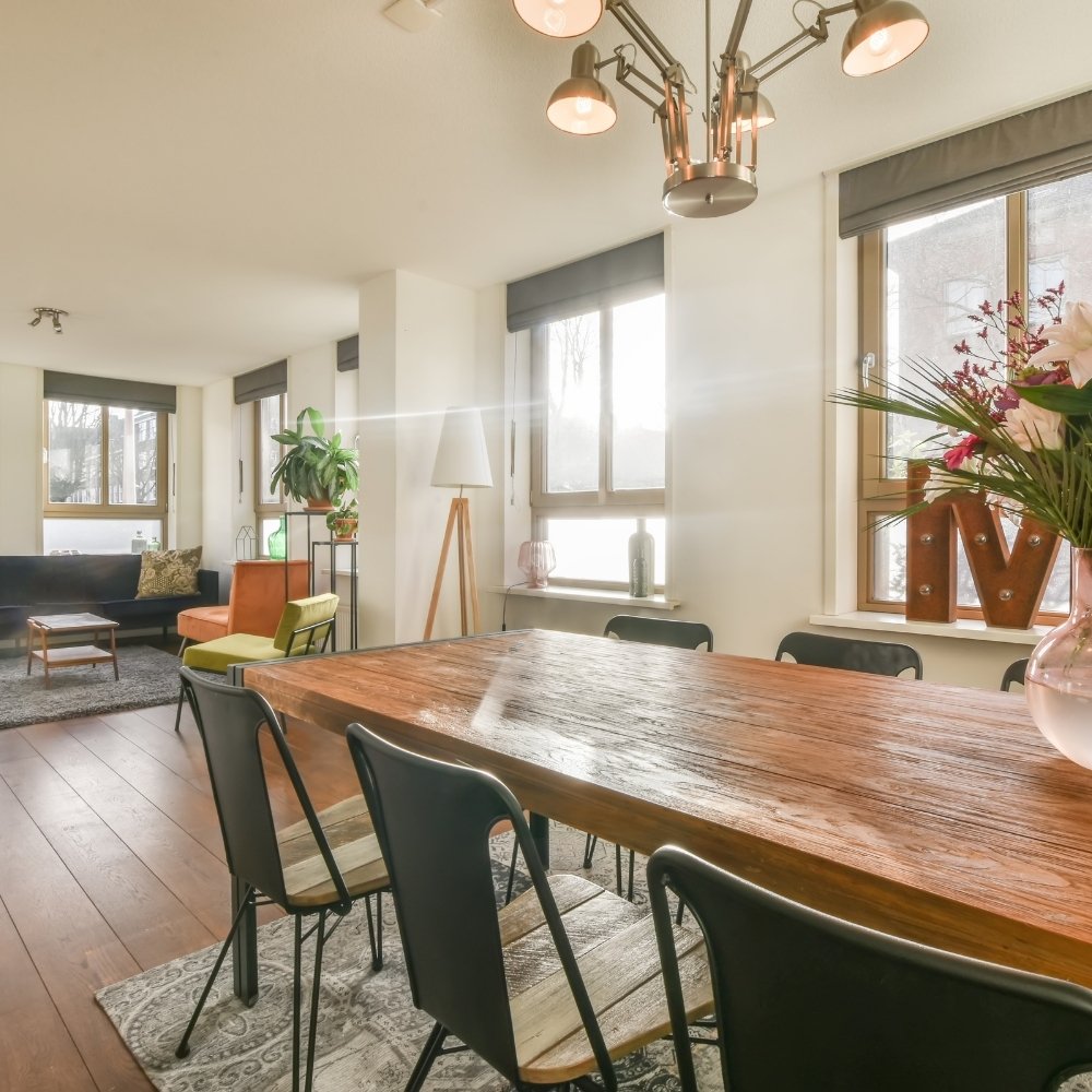 Turnover cleaning service making a bed in Collinsville, OK Airbnb